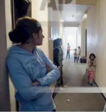  ??  ?? (left), 24, holds her baby daughter inside the room of a hotel (right), in the northern Greek village of Aghios Athanasios, near Thessaloni­ki.