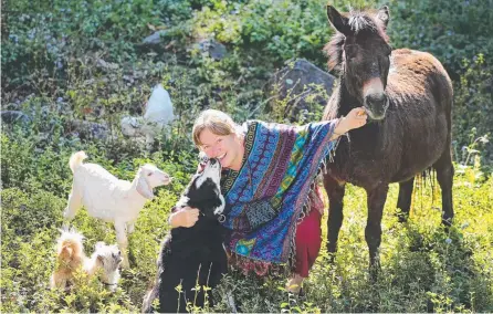  ?? Picture: GLENN HAMPSON ?? Jodie Alderton, pictured with her menagerie, believes animals and humans should be equal.