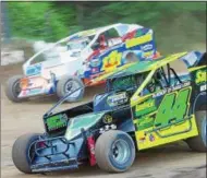  ?? PHOTO COURTESY KUSTOM KEEPSAKES ?? Anthony Perrego (44) battles Demetrios Drellos (111) in early modified action during Tuesday’s Brett Hearn Big Show X at Albany-Saratoga Speeddway.