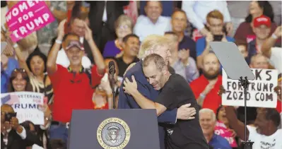  ?? REUTERS PHOTO ?? ‘GREATER THAN EVER BEFORE’: President Trump embraces Gene Huber, a supporter Trump called up on stage during yesterday’s rally in Melbourne, Fla.