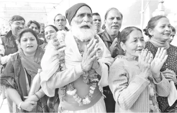  ??  ?? Indian Hindu pilgrims leave the Durgiana Temple after paying their respects on their way to the Pakistani Hindu Katas Raj Temples, in Amritsar. — AFP photo