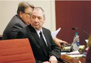  ?? LUIS SÁNCHEZ SATURNO THE NEW MEXICAN ?? Gary Gregor looks at his wife, Judith Gregor, as she enters District Court to testify on Tuesday. Judith Gregor testified that she’d spent time in his classroom when he taught and witnessed no inappropri­ate behavior.