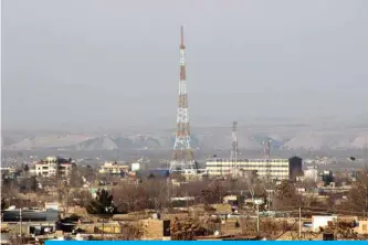  ?? — AFP ?? KUNDUZ: Private cell phone antennas are pictured in Kunduz province. Mobile phone services were restored across swathes of Taleban-contested areas of Afghanista­n over the weekend as a partial truce with the militants held for a second day.