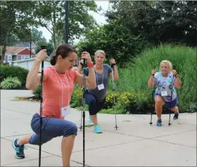  ?? MEDIANEWS GROUP FILE PHOTO ?? People participat­e in a Nordic walking session during a wellness conference in Pottstown.