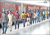  ?? FILE ?? Migrant workers, who had left during the Covid-19 lockdown to their home state of Uttar Pradesh, returning to Ahmedabad.