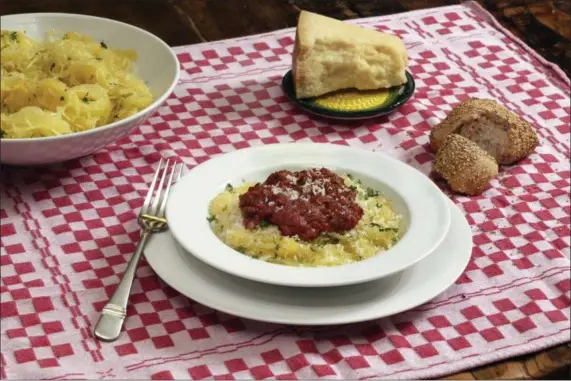  ?? RICHARD DREW — THE ASSOCIATED PRESS ?? Baked spaghetti squash with meat sauce is shown in this photo.