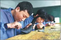  ?? XINHUA ?? Vocational education has been improving with government support in Qinghai province. Young people receive training at an art school and a nursing school.