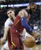  ?? CHARLES KRUPA — THE ASSOCIATED PRESS ?? Cleveland’s LeBron James loses the ball as he is pressured by Boston’s Jayson Tatum during Game 2 of the Eastern Conference finals in Boston om Tuesday.