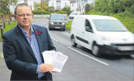  ?? Picture: Martin Apps ?? Leeds Parish Council chairman John Govett with the petition for a relief road in the village