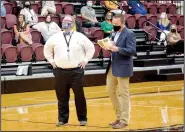  ?? (NWA Democrat-Gazette/Marc Hayot) ?? Middle School Principal Jacob Hayward (left) ponders a question asked by Jimmy Allen on Wednesday during a round of “Are You Smarter than A Fifth Grader?” during the Back to School Breakfast at Siloam Springs High School.