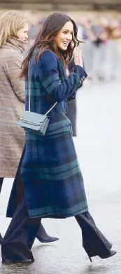  ??  ?? At Edinburgh, Meghan gave a nod to Scottish tradition with a tartan “power coat” by Burberry. Her frequent appearance­s in wide-leg trousers have spiked searches for this favored fashion staple.