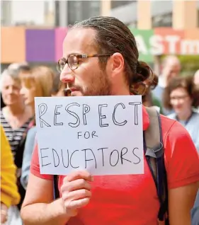  ?? PHOTO: JONATHAN BORG ?? One of the MCAST lecturers at yesterday’s protest.