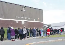  ??  ?? The lineup for tickets started early for the final draw of Chase the Ace at St. Kevin’s Parish Hall in Goulds, near St. John’s, N.L., on Aug. 30. The Catholic parish has the enviable task of deciding how to spend $5.8-million.