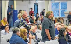  ?? COLIN CHISHOLM ?? Hants County residents Darren Porter and Bill Preston lined up to ask questions during a public meeting on the Halfway River aboiteau on Sept. 10. Whether it’s the Hantsport aboiteau or the twinning of Highway 101 near Windsor, Porter said citizens need to be kept better informed of what’s being proposed.