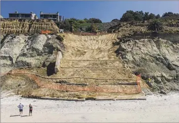  ?? Jarrod Valliere San Diego Union-Tribune ?? A BLUFF COLLAPSE in February came within 35 feet of railroad ties on the only train route between San Diego and Los Angeles. A sea wall is set to protect the bluffs from erosion caused by waves and sea level rise.