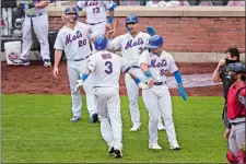  ?? SETH WENIG/AP PHOTO ?? New York Mets catcher Tomás Nido (3) celebrates his grand slam with Pete Alonso, left, Michael Conforto, second from right, and Andres Gimenez during the fifth inning of Thursday’s game against the Washington Nationals at Citi Field in New York.