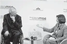  ?? Michaela Handrek-Rehle / Bloomberg ?? House Speaker Nancy Pelosi speaks with Wolfgang Schaeuble, president of the German Bundestag, or parliament, at the Munich Security Conference on Friday.