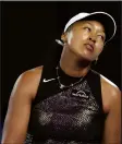  ?? (AP/Asanka Brendon Ratnayake) ?? Naomi Osaka of Japan reacts Monday during her first-round match against Caroline Garcia of France at the Australian Open at Melbourne Park in Melbourne, Australia. Osaka fell 6-4, 7-6 (2) in her first Grand Slam action since taking 15 months off.