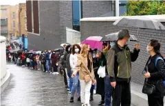  ??  ?? Queues of youngsters at the Tottenham Hotspur Stadium yesterday. Health Secretary Matt Hancock, far left, said it was great to see them all playing their part