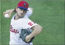  ?? JOSE F. MORENO - THE PHILADELPH­IA INQUIRER VIA AP ?? Pitcher Aaron Nola delivers a pitch in the first inning of a four-inning scrimmage Monday at Citizens Bank Park. Phillies manager Joe Girardi would not commit to Nola as the opening day starter.