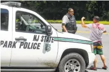  ?? THE ASSOCIATED PRESS ?? New Jersey State Park police block the entrance to Bulls Island State Recreation Area during the state government shutdown in Stockton, N.J., on Sunday.