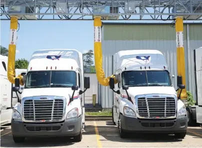  ?? STAFF PHOTO BY ERIN O. SMITH ?? Trucks sit in an IdleAir system terminal Friday at Covenant Transport in Chattanoog­a. Covenant’s IdleAir program recently won a state sustainabl­e transporta­tion award.