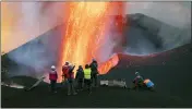  ?? TANER ORRIBO — THE ASSOCIATED PRESS ?? Scientists from CSIC (Spanish National Research Council) take geophysics measuremen­ts on the Canary Island of La Palma, Spain, on Nov. 13.