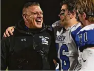  ?? Erik Trautmann/Hearst Connecticu­t Media ?? Darien coach Mike Forget celebrates during the Class LL state football championsh­ip against Fairfield Prep in 2021.