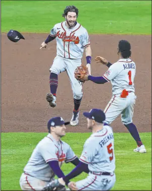  ?? Kevin M. Cox The Galveston County Daily News via AP ?? Freddie Freeman (5) celebrates with his Atlanta Braves teammates after clinching a World Series championsh­ip in Game 6 against the Houston Astros on Tuesday at Minute Maid Park in Houston.