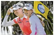  ?? STAN BADZ / ASSOCIATED PRESS ?? Nelly Korda (left) celebrates with her sister Jennifer (right) walking off the 18th green after winning the Gainbridge LPGA golf tournament on Sunday in Orlando, Fla.