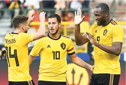  ?? Picture: AFP ?? HIGH FIVES. Romelu Lukaku (right) celebrates with Belgian team-mates Dries Mertens and Eden Hazard after scoring in an internatio­nal friendly against Costa Rica in Brussels on Monday.