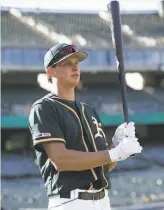  ?? Michael Zagaris / Getty Images 2019 ?? A’s shortstop prospect Logan Davidson, a switchhitt­er, was a firstround pick in 2019.