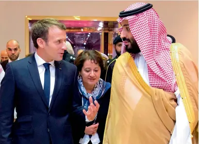  ?? — AFP ?? Saudi Crown Prince Mohammed bin Salman receiving French President Emmanuel Macron in the capital Riyadh.