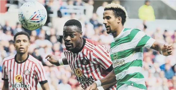  ??  ?? Lamine Kone gets the better of Scott Sinclair in this challenge in the recent 5-0 friendly defeat to Celtic