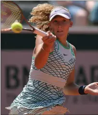  ?? THOMAS SAMSON — THE ASSOCIATED PRESS ?? Russia’s Mirra Andreeva, 16, plays a forehand return to France’s Diane Parry during her second-round, French Open win Thursday. She is the youngest female to reach the third round since 2005.