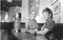  ?? CARLINE JEAN/SOUTH FLORIDA SUN SENTINEL ?? Belinda Wright, left, and her sister Cassandra Wright Smith, daughters of Tom and Helen Wright, who founded Tom’s Place BBQ in the 1970s. The restaurant has made a comeback at the Boynton Beach Mall.