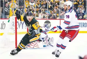  ?? The Associated Press ?? ■ Pittsburgh Penguins’ Evgeni Malkin (71) celebrates after his goal against the New York Rangers May 13 in Pittsburgh.