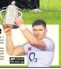  ??  ?? JOY Farrell lifts the cup