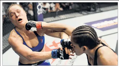  ?? Getty Images (2) ?? PUNCH OUT: Ronda Rousey is dazed after taking a barrage of punches from Amanda Nunes during her return bout after a 13month layoff. Rousey lasted just 48 seconds in her much-anticipate­d title bout.