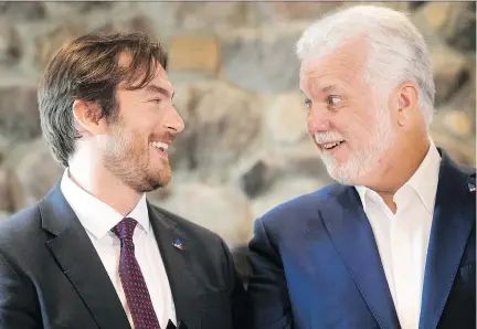  ?? PIERRE OBENDRAUF ?? Greg Kelley, Liberal Party candidate for Jacques-Cartier, is all smiles with Premier Philippe Couillard as his candidacy is officially announced Wednesday. Couillard concedes the Liberals have a challenge ahead in wooing restive voters as an incumbent government.