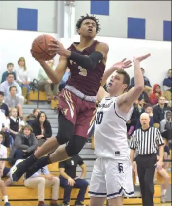  ?? PETE BANNAN — DIGITAL FIRST MEDIA ?? Haverford School’s Tyler Seward, left, drives past Episcopal Academy’s Jack O’Reilly Friday. Seward scored 16 points as the Fords rallied for a 48-46 win over the Churchmen.