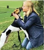  ??  ?? Maher with one of her rescue dogs, Fred; and training a springer spaniel called Ella