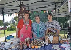  ?? ?? Tasty treats: Anne Foote, Mary Greenshied­ds and Anne Foster at the trading table.