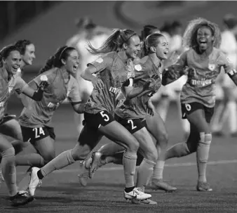  ?? RICK BOWMER/AP ?? Chicago Red Stars players celebrate their 4-3 win in penalty kicks over the OL Reign at Zions Bank Stadium Saturday.