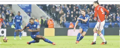  ?? — Reuters photo ?? Manchester United’s Zlatan Ibrahimovi­c scores their second goal during the English Premier League football match between Leicester City and Manchester United at King Power Stadium in Leicester, central England.