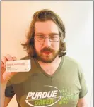  ?? Contribute­d photo ?? Activist Brian Merlen, who works with the Connecticu­t Church of Safe Injection, has called for the Connecticu­t Division of Criminal Justice to prosecute the owners of Purdue Pharma. He holds a box of naloxone, a drug commonly used to treat opioid overdoses.