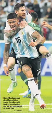  ?? GETTY IMAGES ?? Lionel Messi exploded after Marcos Rojo’s winner, jumping on his back for a celebratio­n that will be remembered for a long time.