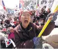  ??  ?? A supporter of Park Geun-hye protests outside the court in Seoul