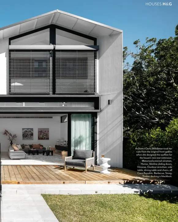  ??  ?? Architect Carla Middleton took her cues from the original front gables when she designed the roofline for the house’s new rear extension. Motorised external venetian, Horiso. Slimline sliding doors, Vitrocsa. Outdoor armchair, side table, dining table and chairs, all Coco Republic. Barbecue, Smeg. Timber decking is blackbutt.