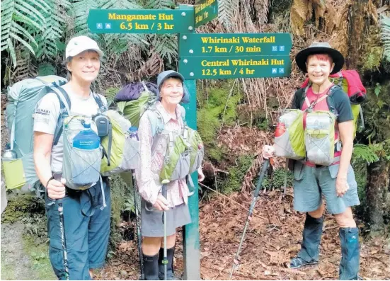  ?? Photo / Supplied ?? Lyneke Onderwater, Val Wackrow and Cherry Channon at a crossroads in the Whirinaki park. Note their matching packs.